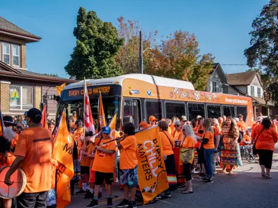 Truth and Reconciliation GRT bus with people